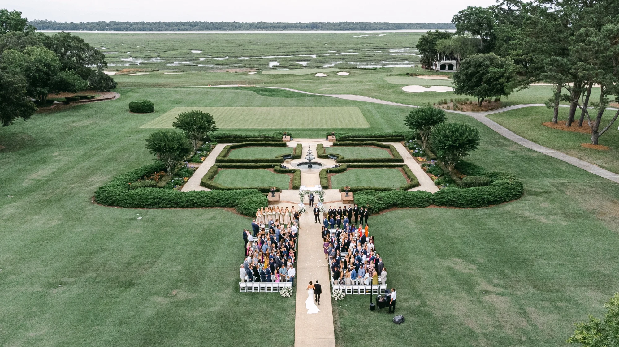 An outdoor wedding ceremony viewed from above